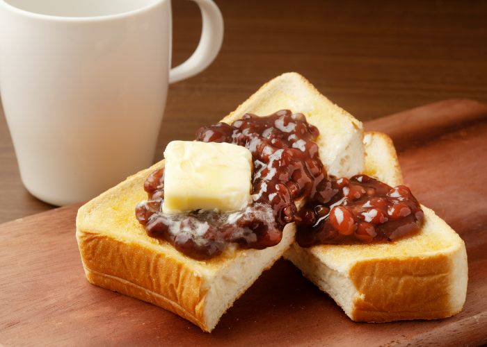 A Nagoya specialty of toast with red beans and butter melting on top.